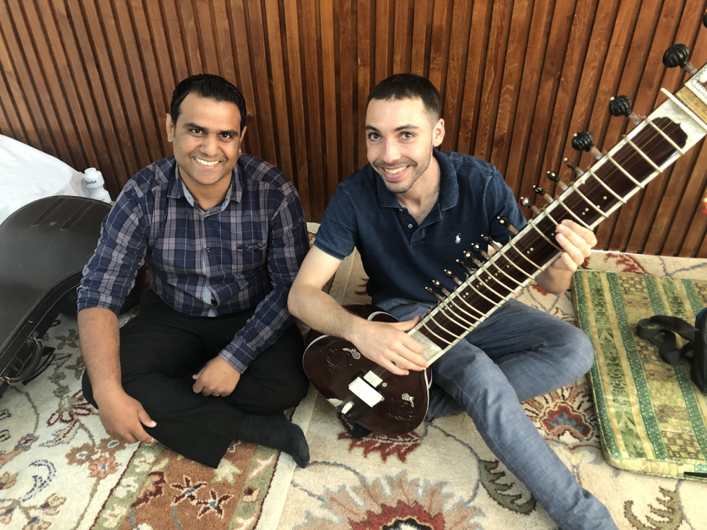 Kassabian learns how to play the sitar
