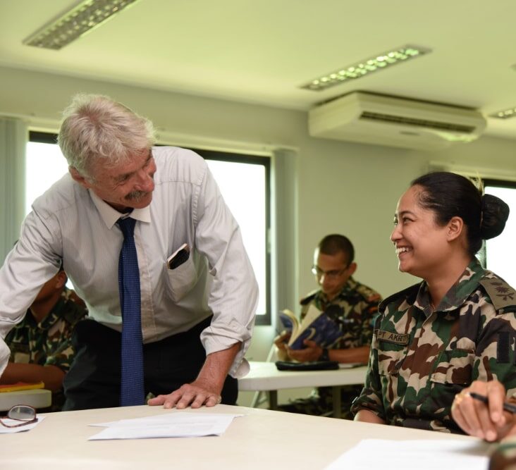 Specialist in Nepal meets with military officers in ESP course