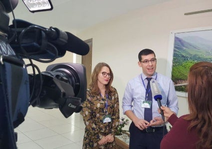 Fellow giving an interview to a reporter