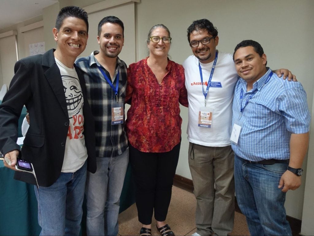 Specialist Mary Scholl with participants in Central and South America