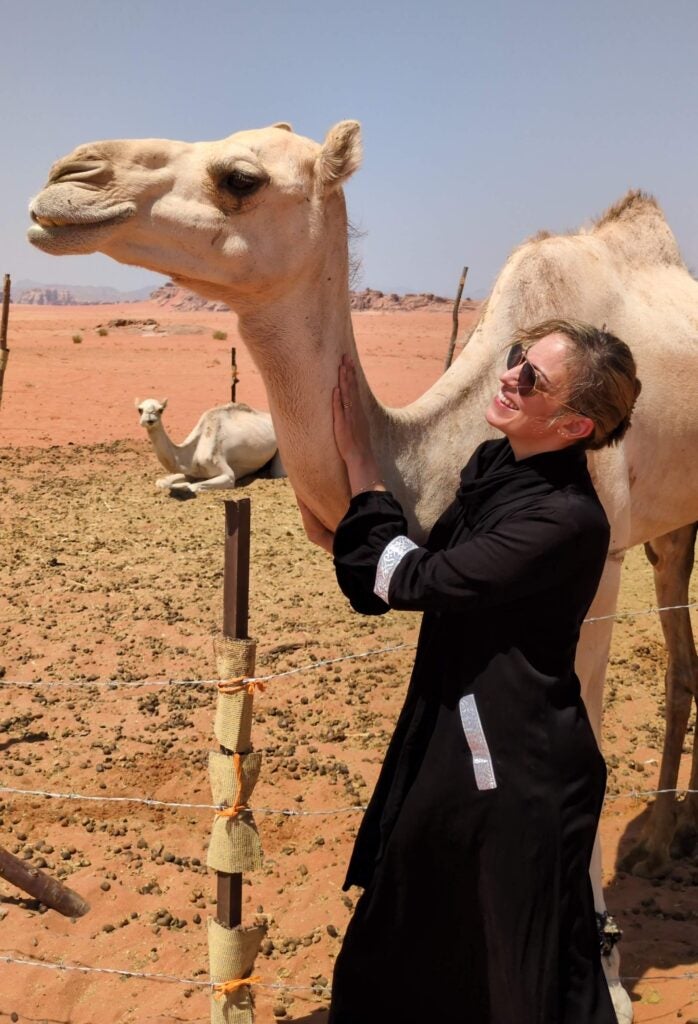 Callahan Neginskiy visiting with a local camel 