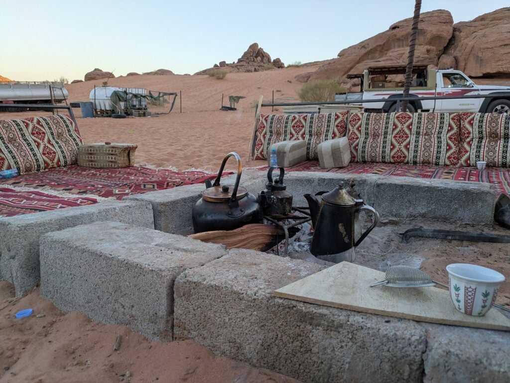 The seating area all set up for dinner in the desert 